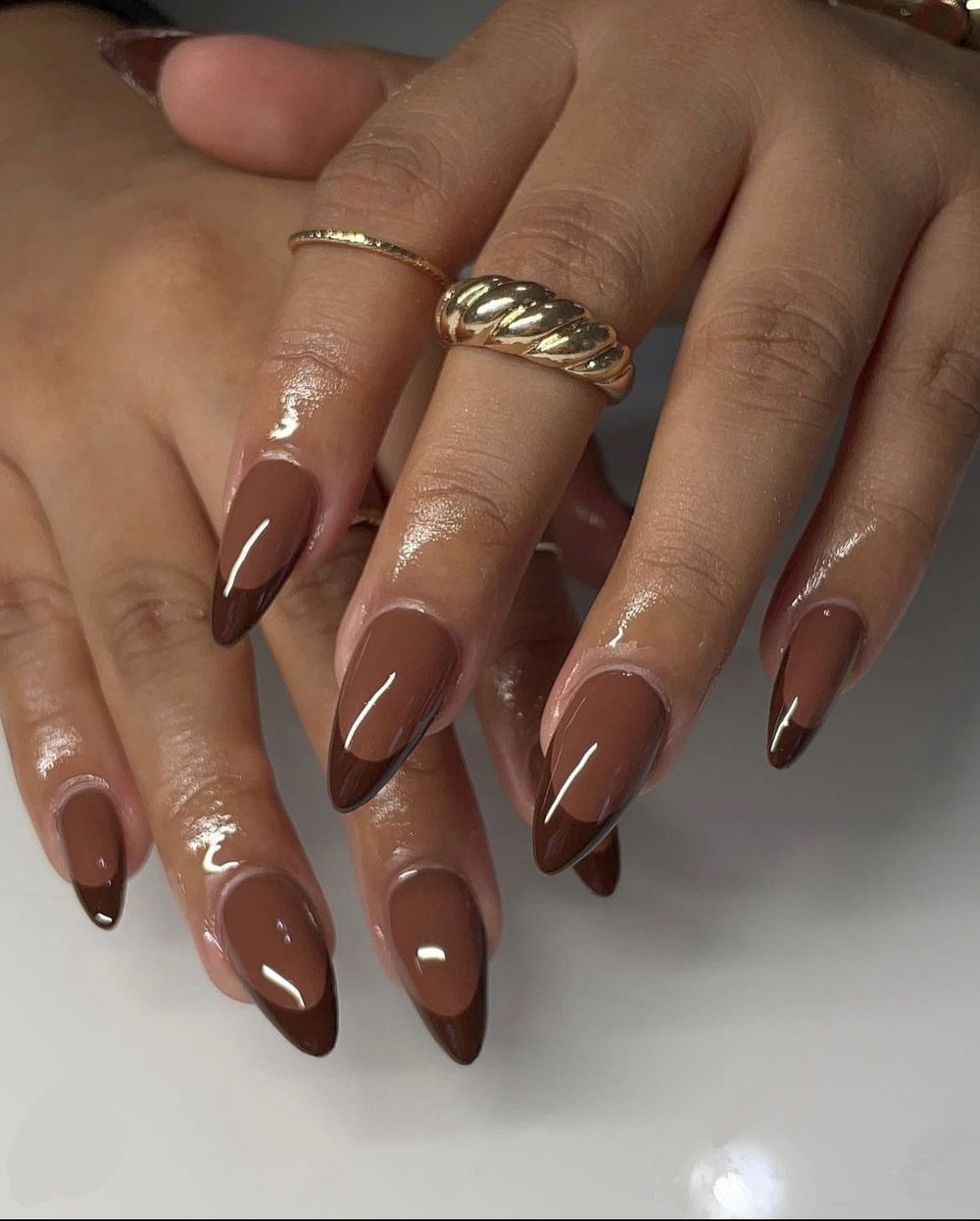 Glossy chocolate brown almond nails, long milk chocolate gel set with soft studio light