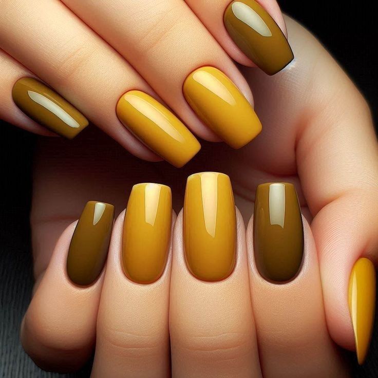 Mustard and olive green coffin nails, glossy goldenrod and moss shades alternating on both hands
